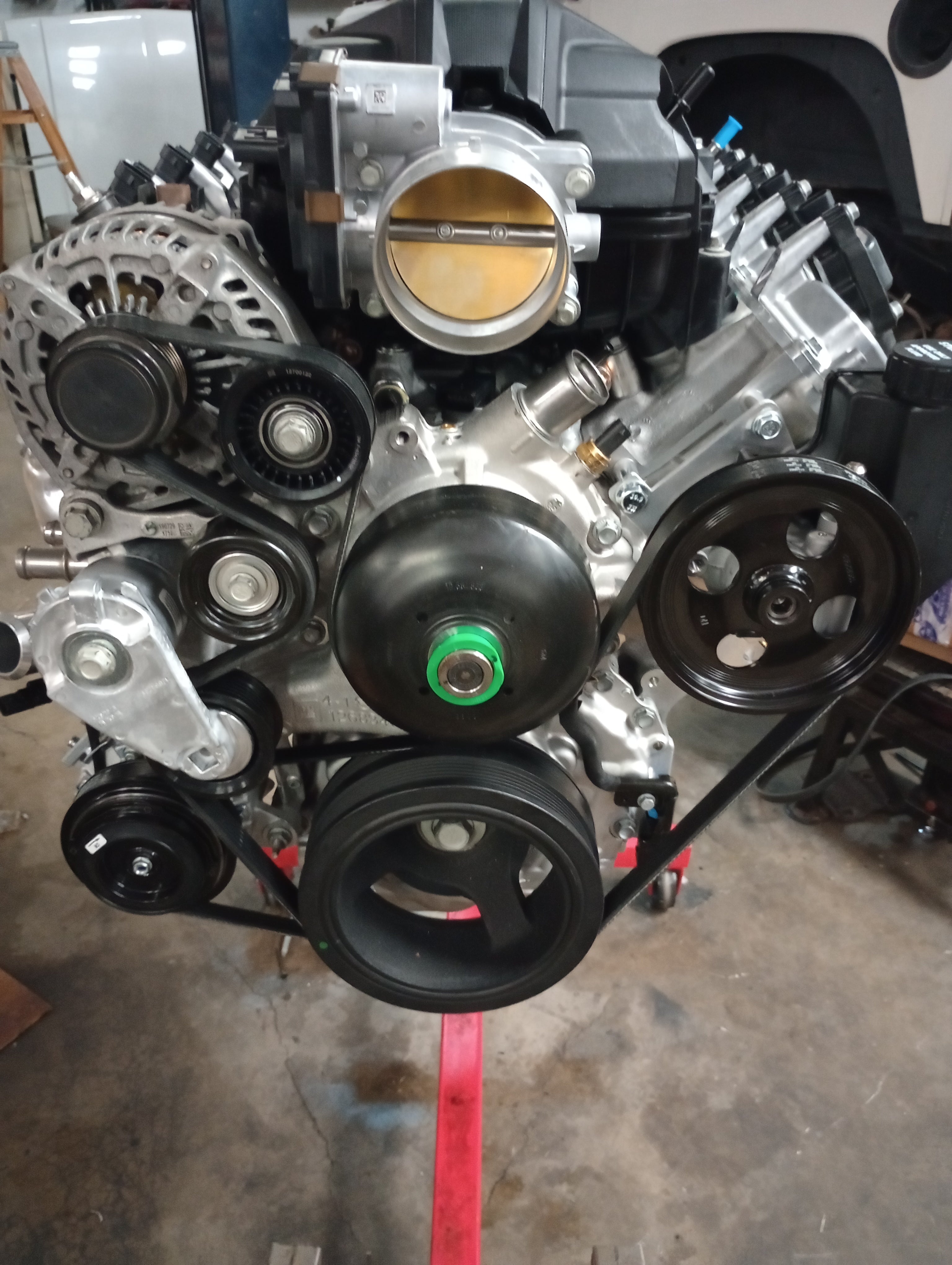 Wicked Wrench Motorsports Gen V LT standalone power steering pump bracket kit mounted on an engine showing the front drive layout