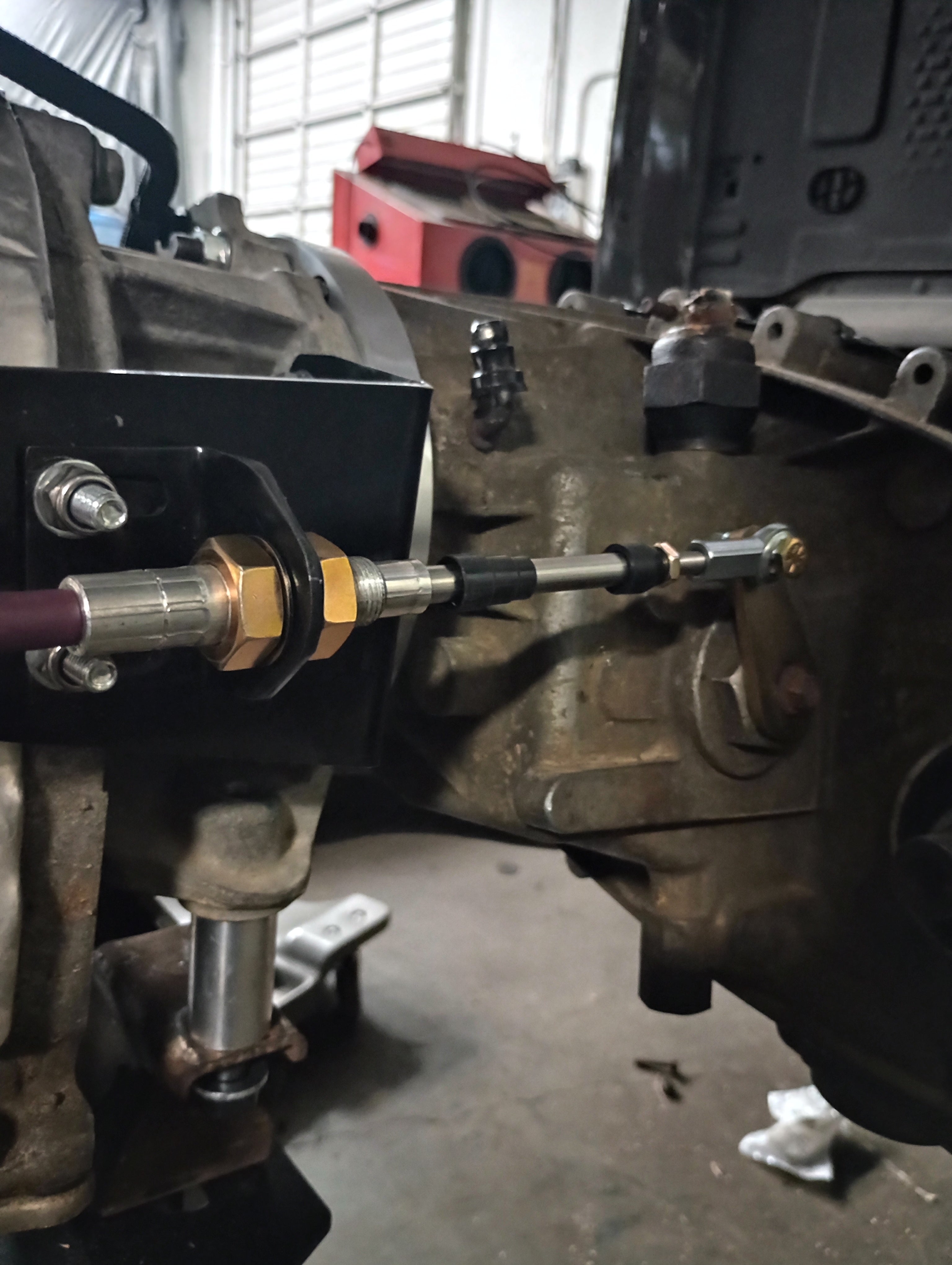 Wicked Wrench Motorsports heavy duty shift cable mounting setup connected directly to the Jeep Wrangler 241J transfer case lever side view
