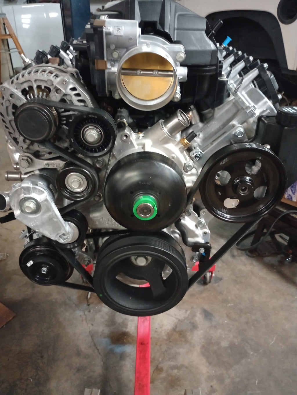 Wicked Wrench Motorsports Gen V LT standalone power steering pump bracket kit mounted on an engine showing the front drive layout