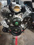 Wicked Wrench Motorsports Gen V LT standalone power steering pump bracket kit mounted on an engine showing the front drive layout