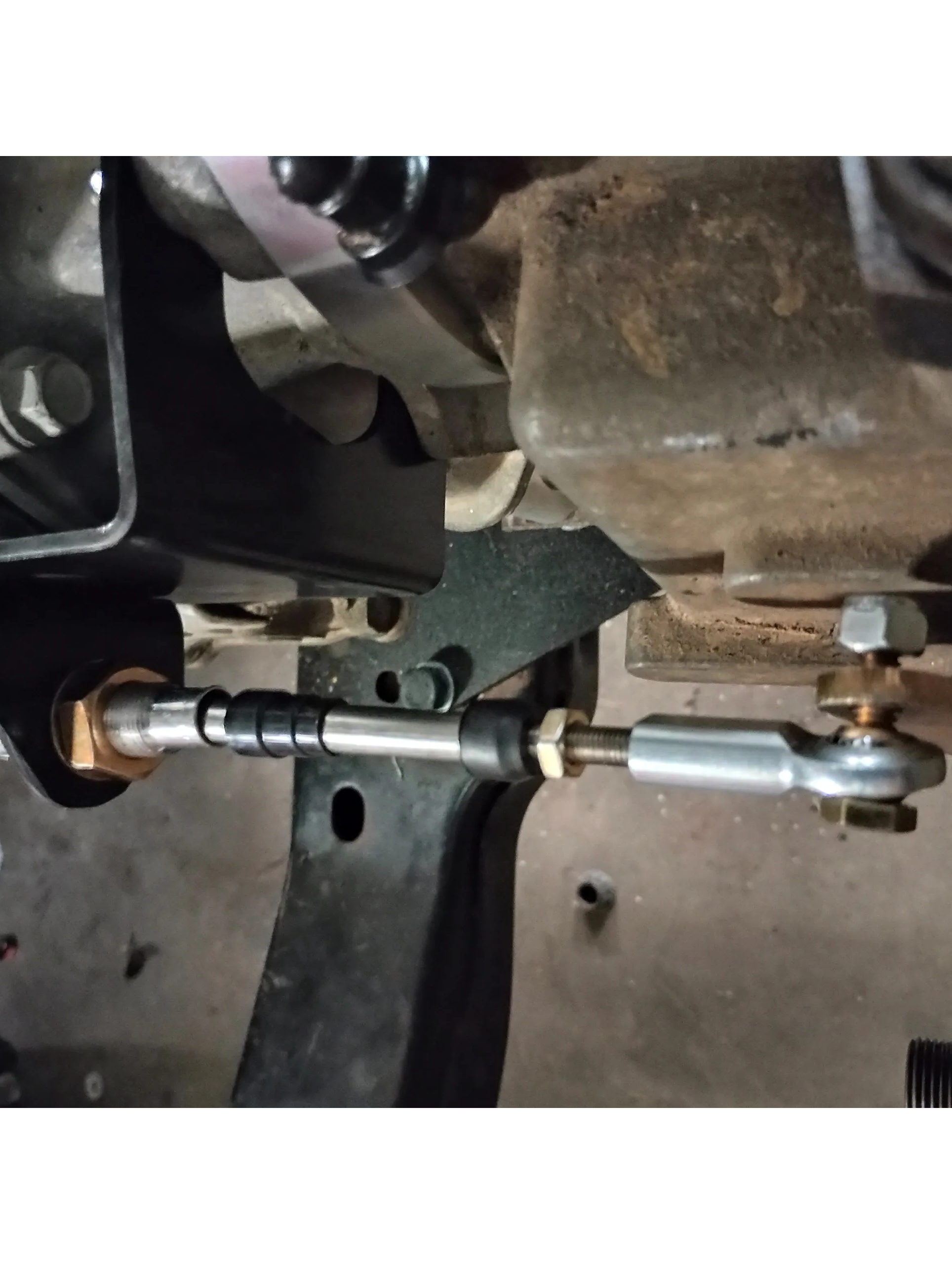 Wicked Wrench Motorsports top view looking down at the heavy duty shift cable and beef up bracket mounted to the Jeep 241J transfer case lever