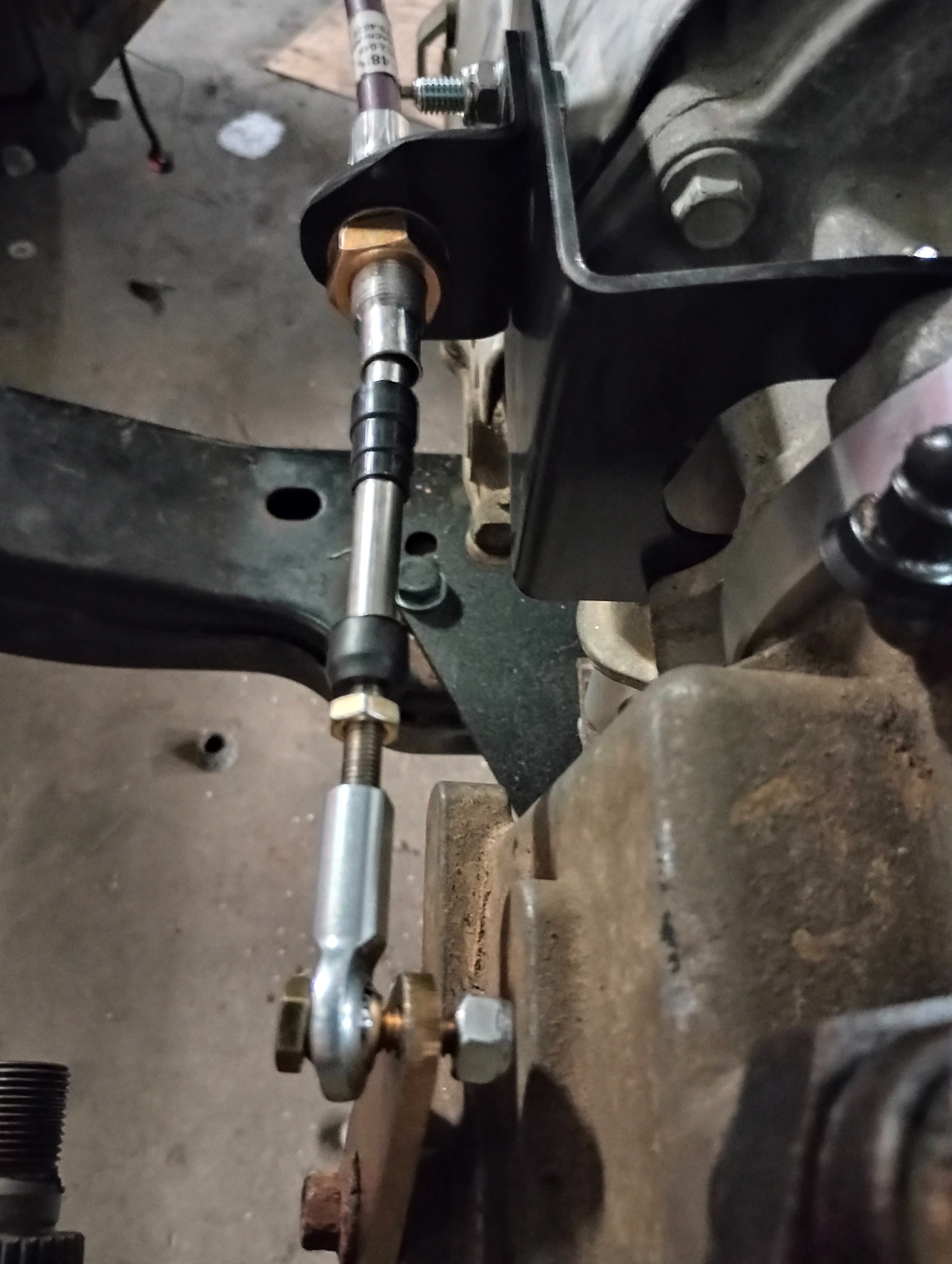 Wicked Wrench Motorsports heavy duty transfer case beef up bracket installed on a Jeep Wrangler showing top to front view bolt alignment