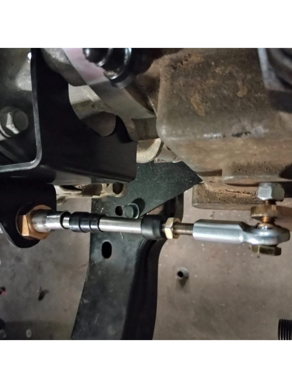 Wicked Wrench Motorsports top view looking down at the heavy duty shift cable and beef up bracket mounted to the Jeep 241J transfer case lever